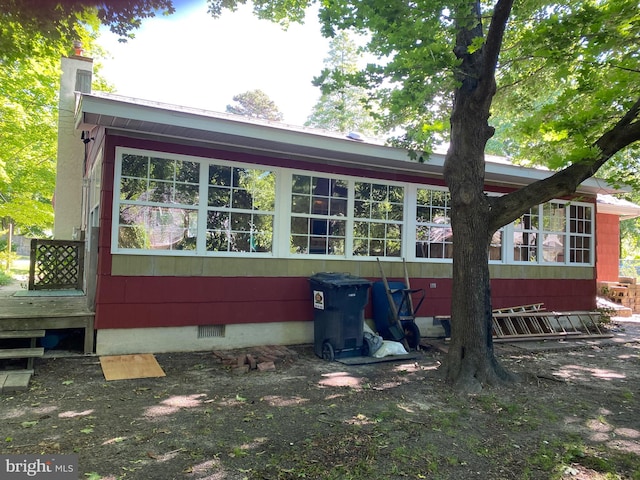 724 Ocean Ave, Galloway, NJ 08205 - back of house with crawl space and a chimney