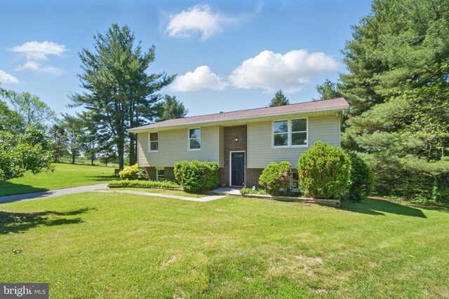 4202 Wolf Ct, Hampstead, MD 21074 - split foyer home featuring a front yard and brick siding