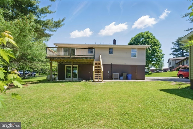 4202 Wolf Ct, Hampstead, MD 21074 - rear view of property featuring a wooden deck, stairway, central AC, and a yard