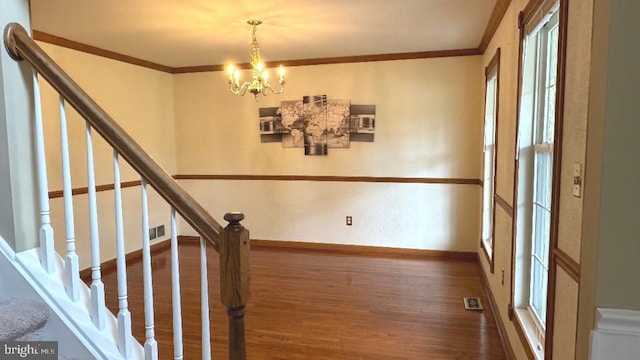 9 Whirlaway Dr, Bear, DE 19701 - stairway featuring wood finished floors, a chandelier, baseboards, and ornamental molding
