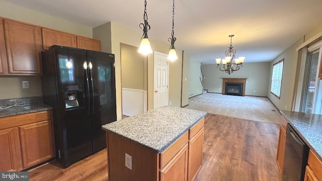 9 Whirlaway Dr, Bear, DE 19701 - kitchen with black fridge, dishwashing machine, open floor plan, and light wood-style floors