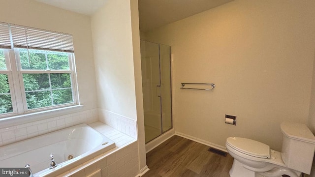 9 Whirlaway Dr, Bear, DE 19701 - full bathroom featuring a jetted tub, toilet, wood finished floors, a shower with door, and baseboards