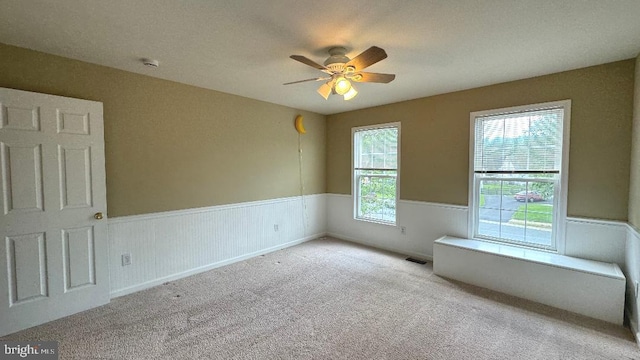 9 Whirlaway Dr, Bear, DE 19701 - carpeted empty room with a wainscoted wall, ceiling fan, and a smoke detector