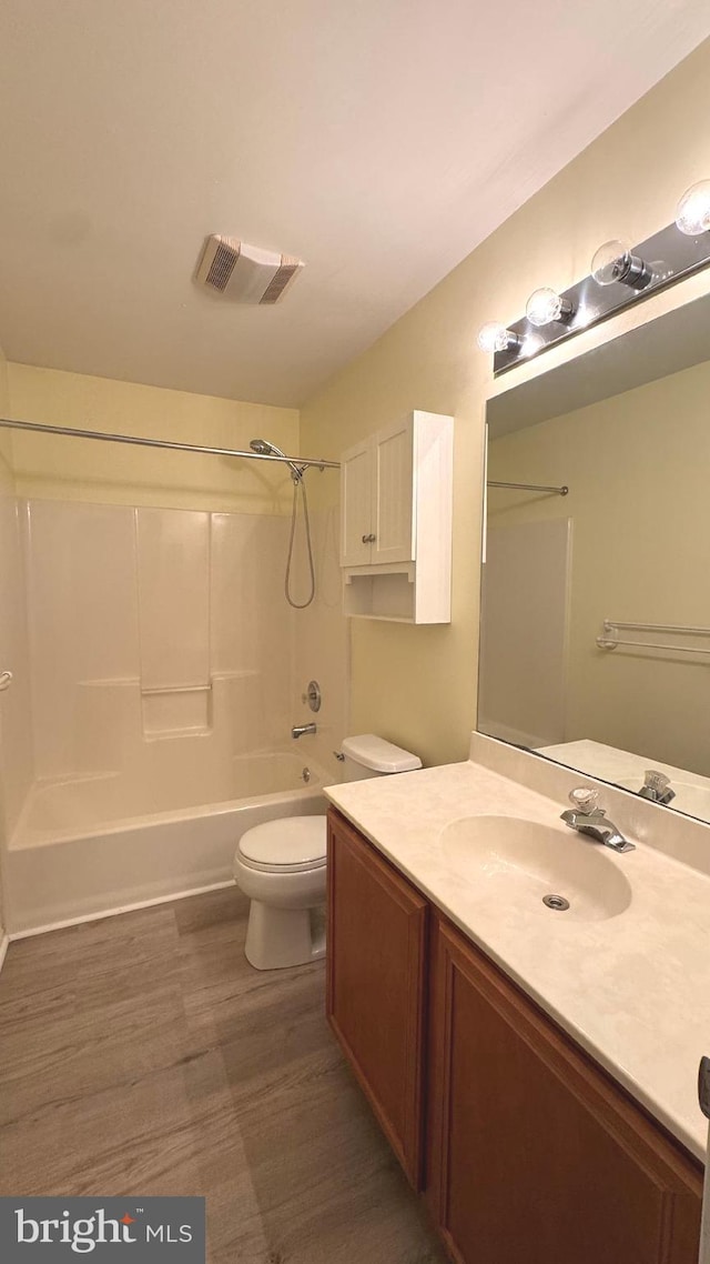 9 Whirlaway Dr, Bear, DE 19701 - bathroom featuring vanity, bathing tub / shower combination, toilet, and wood finished floors