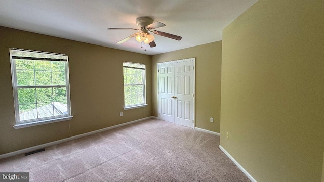 9 Whirlaway Dr, Bear, DE 19701 - unfurnished bedroom with light carpet, baseboards, a closet, and ceiling fan