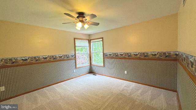 9 Whirlaway Dr, Bear, DE 19701 - carpeted empty room featuring wainscoting, a ceiling fan, and wallpapered walls
