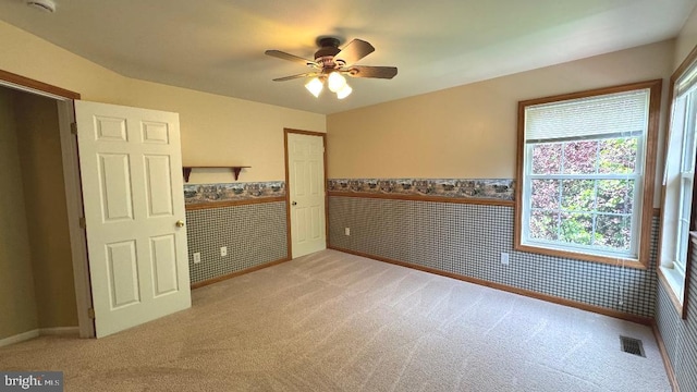 9 Whirlaway Dr, Bear, DE 19701 - spare room with wainscoting, light colored carpet, a ceiling fan, and baseboards