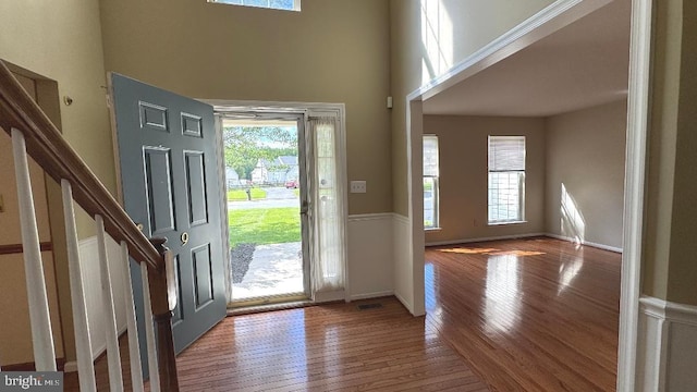 9 Whirlaway Dr, Bear, DE 19701 - foyer entrance with healthy amount of natural light, a towering ceiling, wood finished floors, and stairway