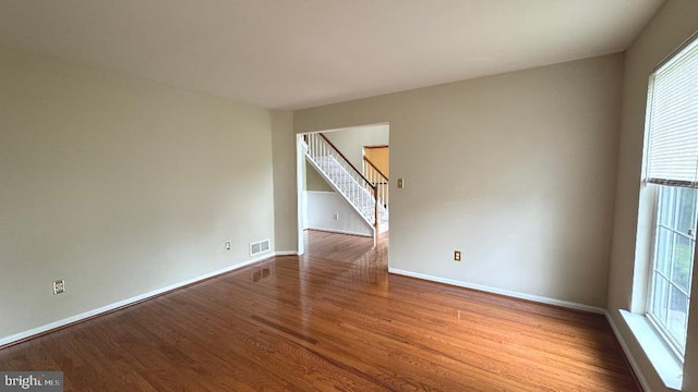 9 Whirlaway Dr, Bear, DE 19701 - unfurnished room featuring wood finished floors, stairs, and baseboards