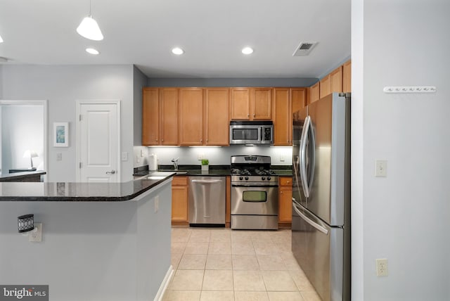2665 Prosperity Ave Unit 109, Fairfax, VA 22031 - kitchen with stainless steel appliances, light tile patterned floors, recessed lighting, a sink, and decorative light fixtures