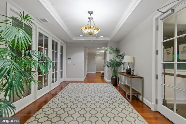 2665 Prosperity Ave Unit 109, Fairfax, VA 22031 - hallway with recessed lighting, wood finished floors, baseboards, ornamental molding, and a chandelier