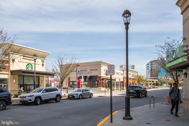 2665 Prosperity Ave Unit 109, Fairfax, VA 22031 - view of asphalt street with street lights, sidewalks, and curbs