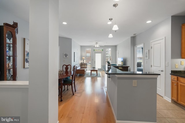 2665 Prosperity Ave Unit 109, Fairfax, VA 22031 - kitchen with dark countertops, open floor plan, hanging light fixtures, recessed lighting, and a ceiling fan