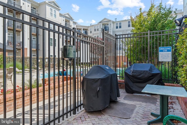2665 Prosperity Ave Unit 109, Fairfax, VA 22031 - view of patio / terrace featuring a grill and a residential view
