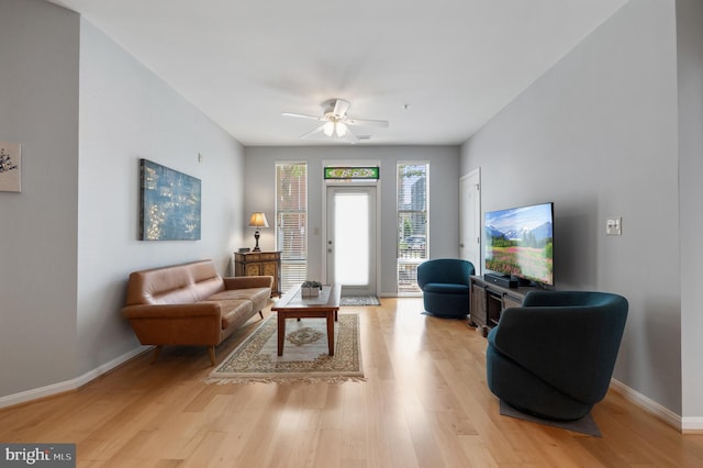 2665 Prosperity Ave Unit 109, Fairfax, VA 22031 - living room featuring light wood finished floors, baseboards, and a ceiling fan