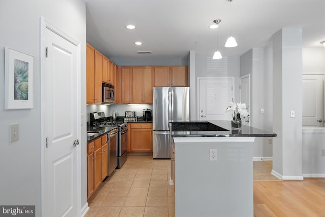 2665 Prosperity Ave Unit 109, Fairfax, VA 22031 - kitchen featuring stainless steel appliances, a center island, pendant lighting, recessed lighting, and baseboards