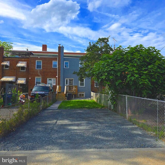5623 Eads St NE, Washington, DC 20019 - view of front facade featuring a chimney and central AC unit