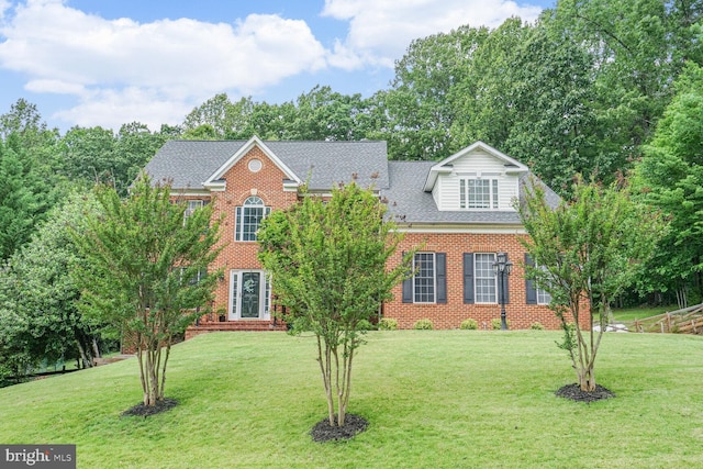 4904 Charmed Ct, Woodbridge, VA 22192 - colonial house with a front lawn, brick siding, and roof with shingles
