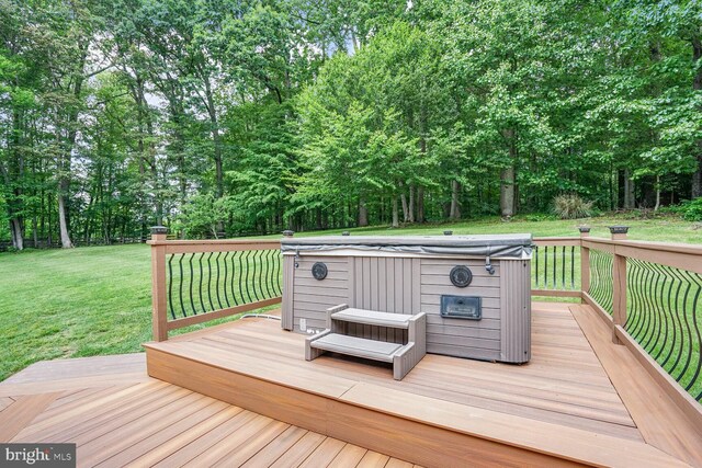 4904 Charmed Ct, Woodbridge, VA 22192 - wooden deck featuring a hot tub, a lawn, and view of scattered trees