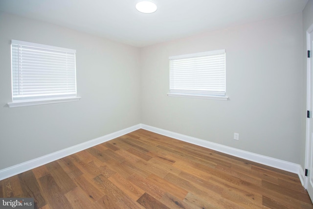 1407 Ruatan St, Hyattsville, MD 20783 - unfurnished room featuring baseboards and wood finished floors