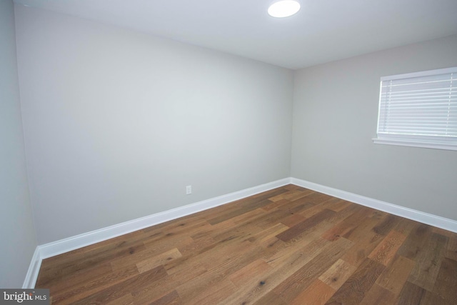 1407 Ruatan St, Hyattsville, MD 20783 - empty room featuring baseboards and dark wood-type flooring