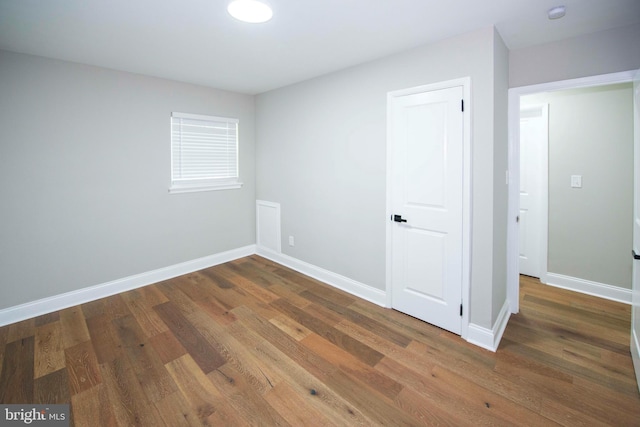 1407 Ruatan St, Hyattsville, MD 20783 - unfurnished bedroom with wood finished floors and baseboards