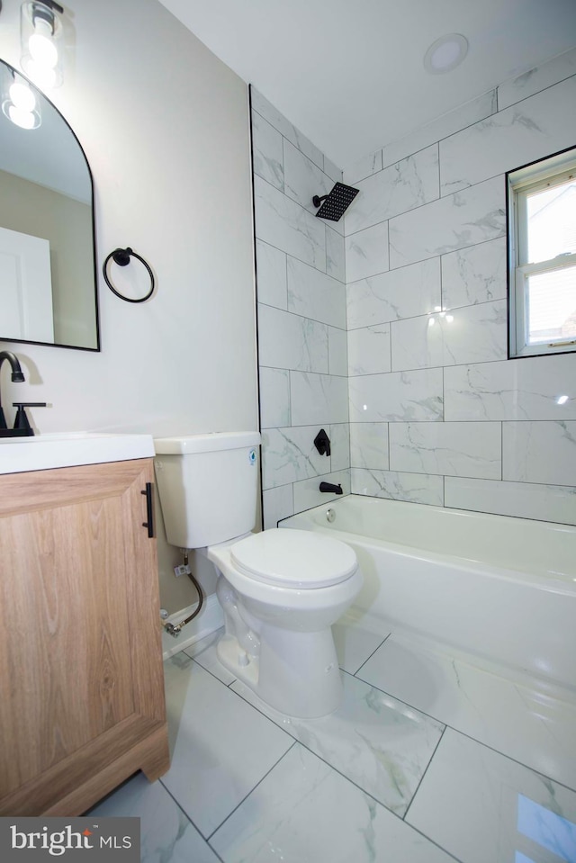 1407 Ruatan St, Hyattsville, MD 20783 - full bathroom with toilet, marble look tile flooring, vanity, and bathtub / shower combination