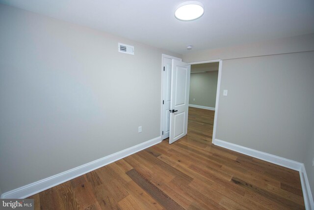1407 Ruatan St, Hyattsville, MD 20783 - empty room with wood finished floors and baseboards