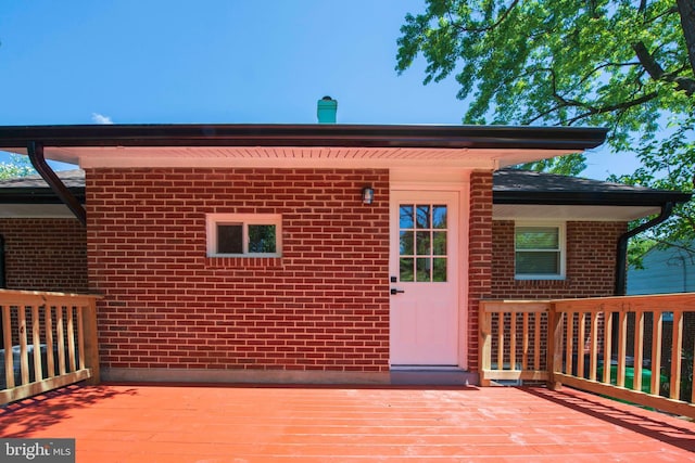 1407 Ruatan St, Hyattsville, MD 20783 - rear view of property featuring a deck and brick siding
