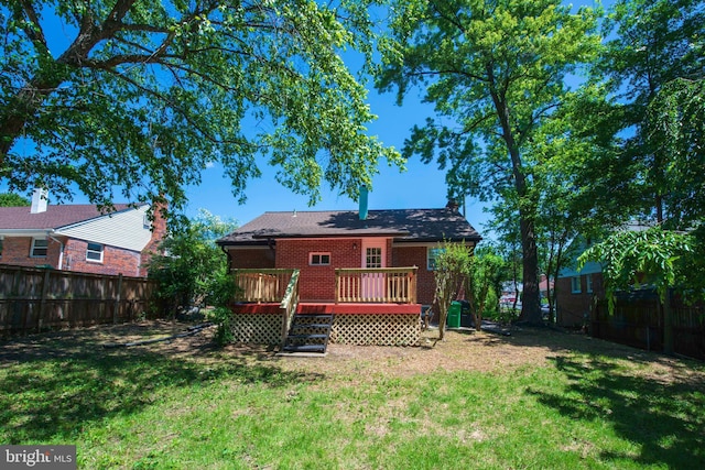1407 Ruatan St, Hyattsville, MD 20783 - back of property with a wooden deck and brick siding