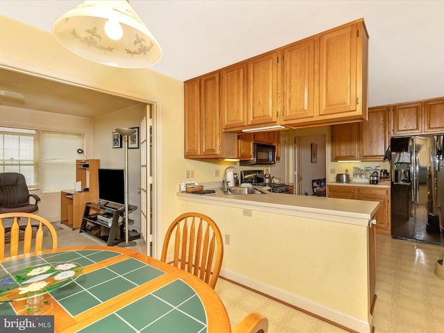 2409 Bear Den Rd, Frederick, MD 21701 - kitchen featuring fridge with ice dispenser, a sink, black microwave, range, and light countertops