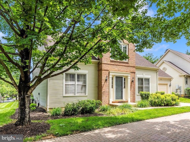 2409 Bear Den Rd, Frederick, MD 21701 - view of front of house featuring a garage and a shingled roof