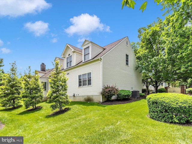 2409 Bear Den Rd, Frederick, MD 21701 - view of side of property featuring central air condition unit, a yard, and roof with shingles