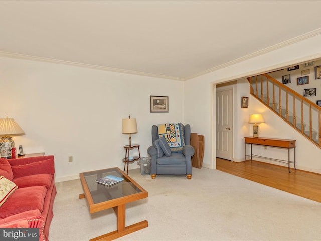 2409 Bear Den Rd, Frederick, MD 21701 - carpeted living room featuring stairway, ornamental molding, baseboards, and wood finished floors