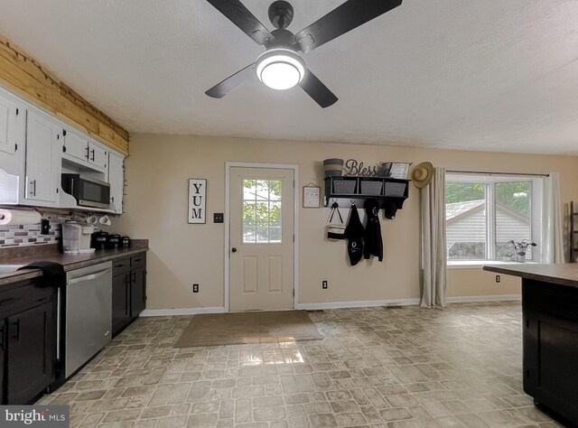 24950 Morgan Rd, Hollywood, MD 20636 - kitchen with appliances with stainless steel finishes, baseboards, healthy amount of natural light, tasteful backsplash, and a textured ceiling