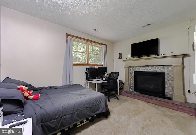 24950 Morgan Rd, Hollywood, MD 20636 - bedroom featuring carpet, a textured ceiling, a tiled fireplace, and an office area