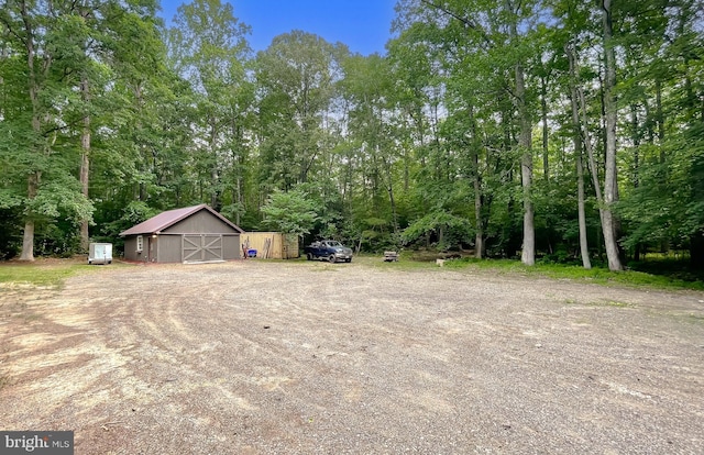 24950 Morgan Rd, Hollywood, MD 20636 - view of yard featuring a detached garage, an outdoor structure, and a barn