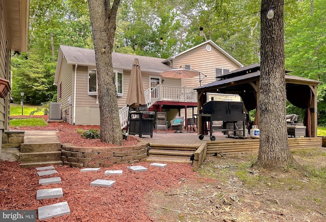 24950 Morgan Rd, Hollywood, MD 20636 - back of house featuring a gazebo, a wooden deck, central AC unit, and roof with shingles