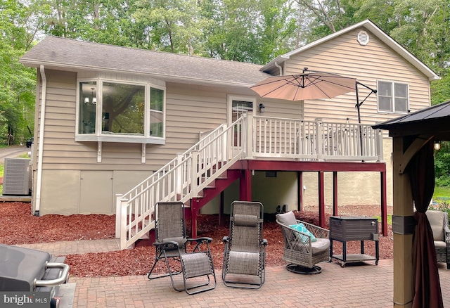 24950 Morgan Rd, Hollywood, MD 20636 - back of property featuring a patio, central AC, stairs, a shingled roof, and a wooden deck