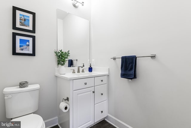 8516 Silver Laurel Ln, Frederick, MD 21704 - bathroom featuring toilet, baseboards, and vanity