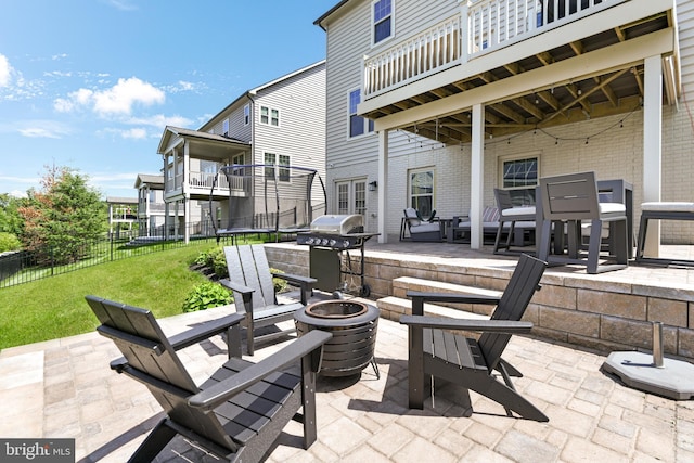 8516 Silver Laurel Ln, Frederick, MD 21704 - view of patio featuring an outdoor fire pit, a trampoline, and a grill