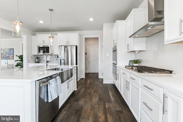 8516 Silver Laurel Ln, Frederick, MD 21704 - kitchen with wall chimney range hood, appliances with stainless steel finishes, backsplash, light countertops, and white cabinets