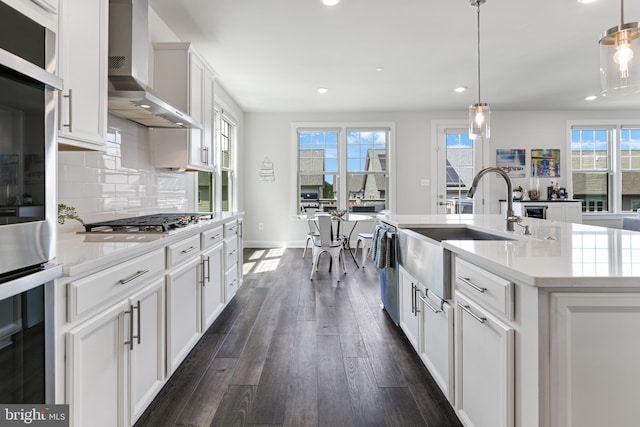 8516 Silver Laurel Ln, Frederick, MD 21704 - kitchen featuring a sink, wall chimney exhaust hood, recessed lighting, dark wood-style floors, and stainless steel appliances