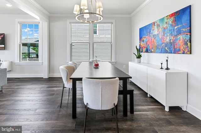 8516 Silver Laurel Ln, Frederick, MD 21704 - dining space featuring a chandelier, dark wood-style floors, crown molding, healthy amount of natural light, and baseboards