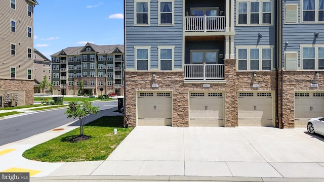 3411 Angelica Way Unit 303, Frederick, MD 21704 - view of property featuring a garage and driveway