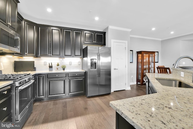 3411 Angelica Way Unit 303, Frederick, MD 21704 - kitchen featuring appliances with stainless steel finishes, a sink, tasteful backsplash, dark cabinets, and ornamental molding