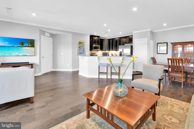 3411 Angelica Way Unit 303, Frederick, MD 21704 - living area featuring recessed lighting, crown molding, baseboards, and wood finished floors