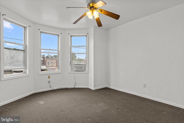 1504 N 57th St, Philadelphia, PA 19131 - spare room featuring dark carpet, baseboards, ceiling fan, and cooling unit