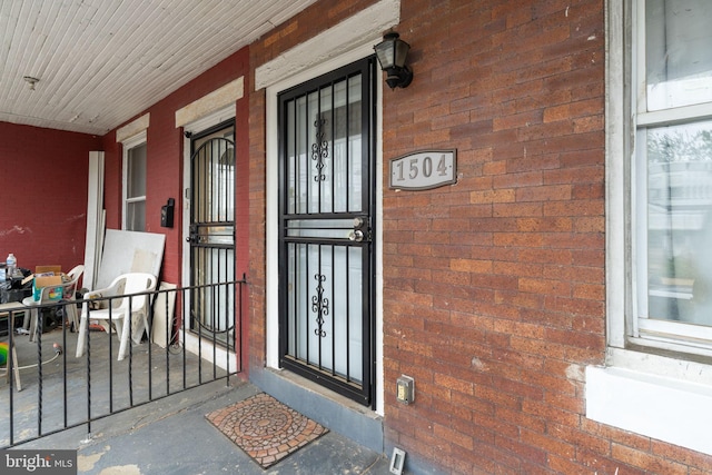 1504 N 57th St, Philadelphia, PA 19131 - doorway to property featuring brick siding