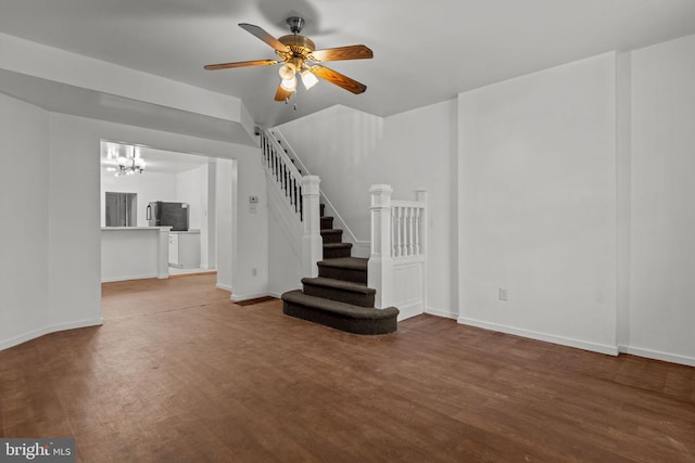 1504 N 57th St, Philadelphia, PA 19131 - unfurnished living room with a chandelier, baseboards, and wood finished floors